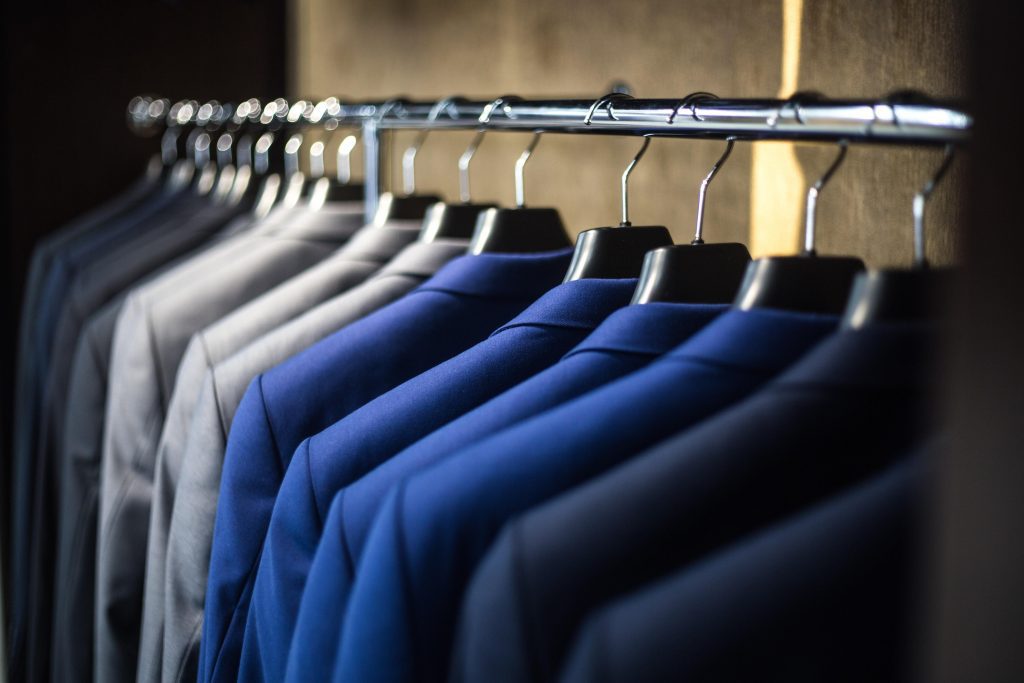 Row of suit jackets hanging