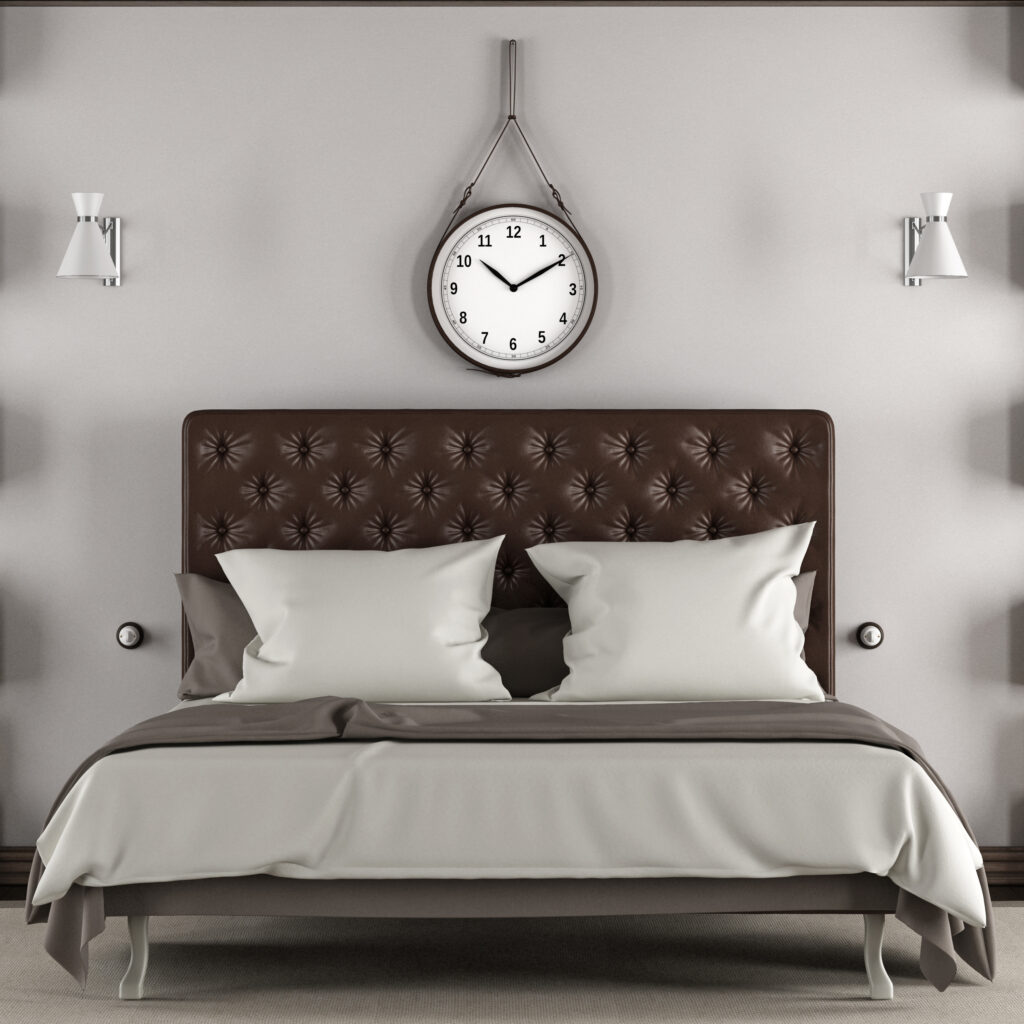 Luxury hotel-style bed with crisp linens and tufted headboard in modern bedroom