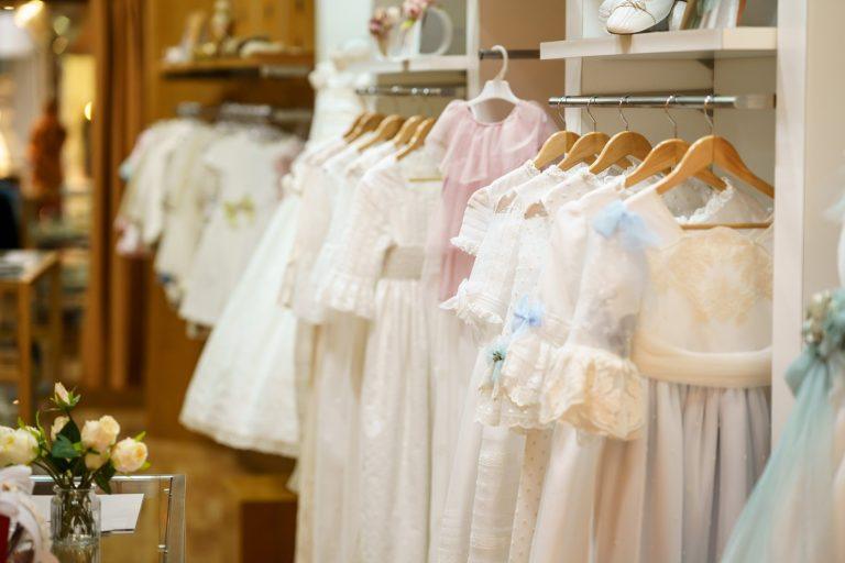 Display rack with couture children's dresses and clothing