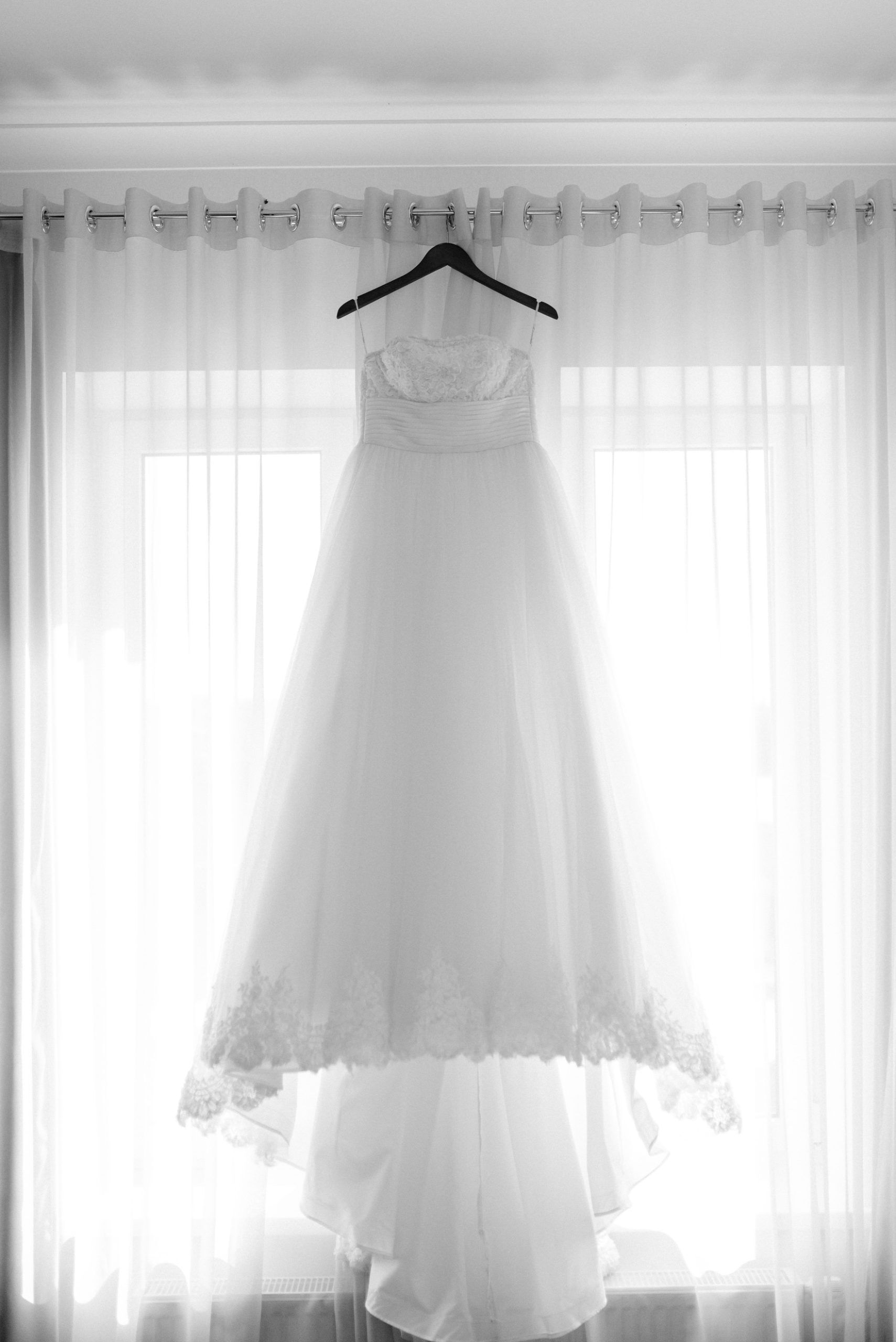 Wedding dress hangs in the window