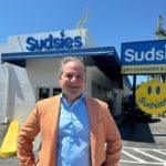 Jason Loeb standing outside Sudsies Dry Cleaners North Miami location