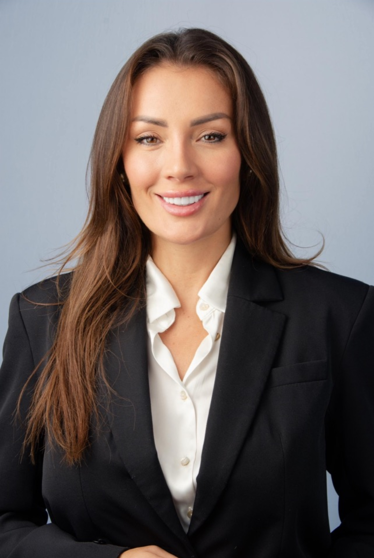 smiling, professional woman in a business suit