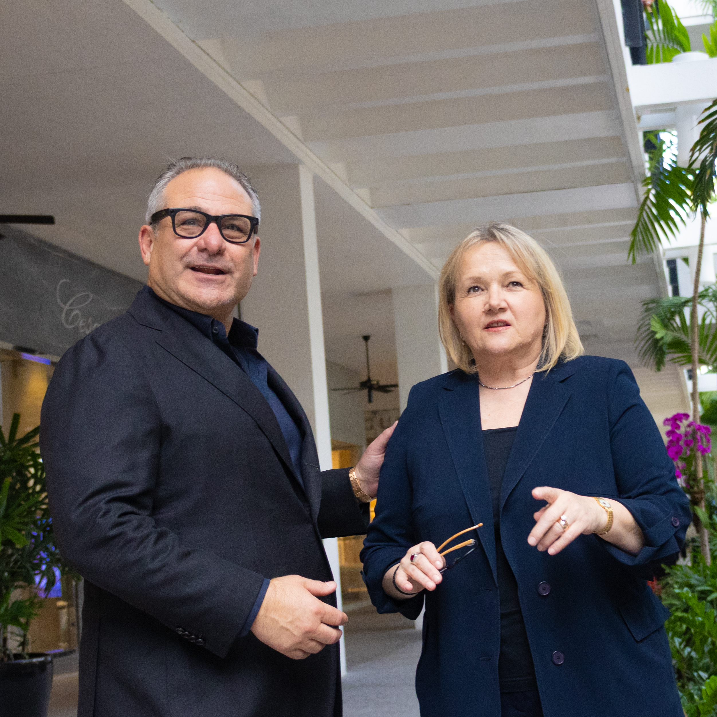 Meiloute Marquez of Akris and Jason Loeb of Sudsies share a moment celebrating two decades of luxury guest care.