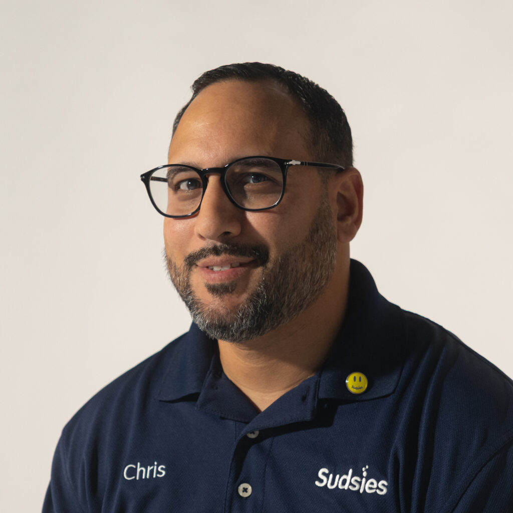 Chris, a Sudsies valet providing expert garment care with a personal touch