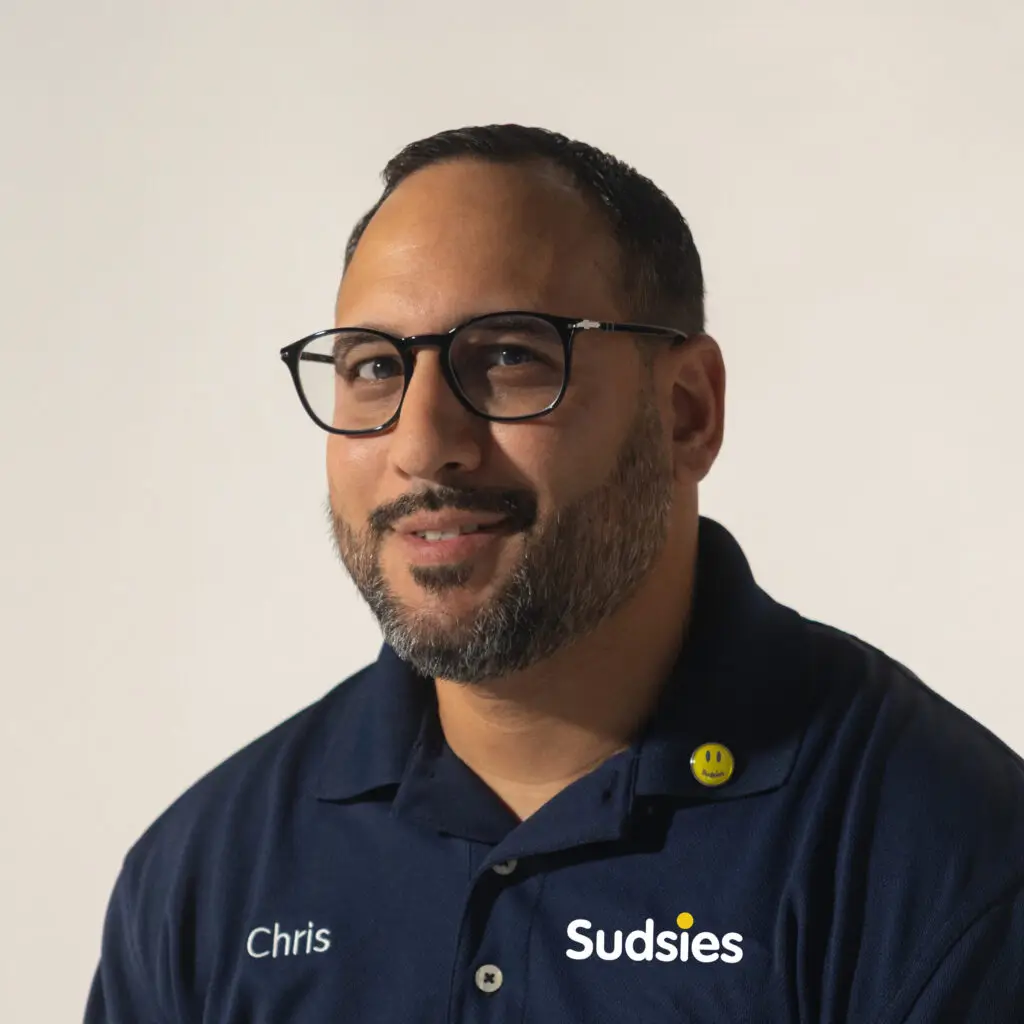 Chris, a Sudsies valet providing expert garment care with a personal touch