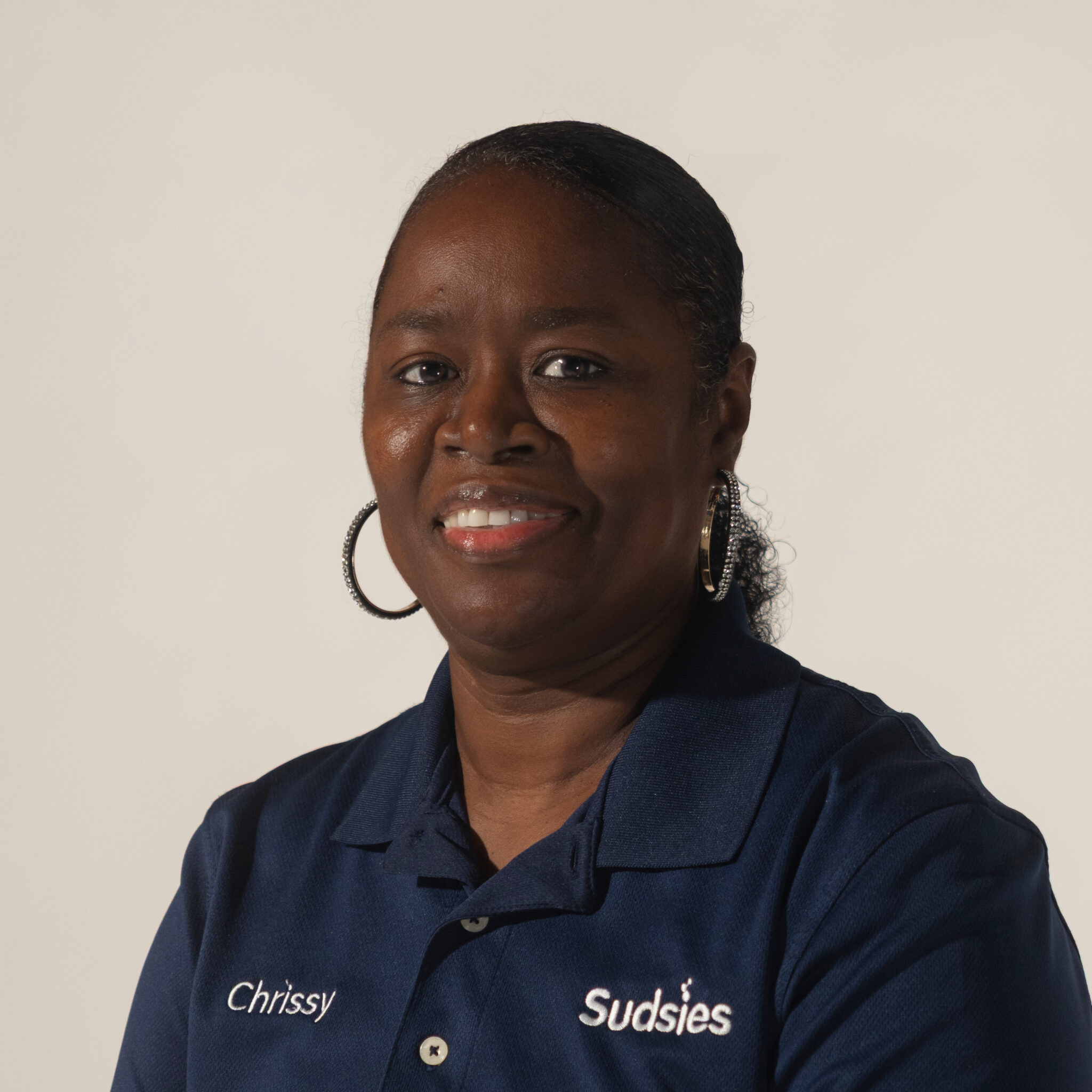 Portrait of Christene Smith, Guest Services Leader at Sudsies’ Fort Lauderdale boutique.