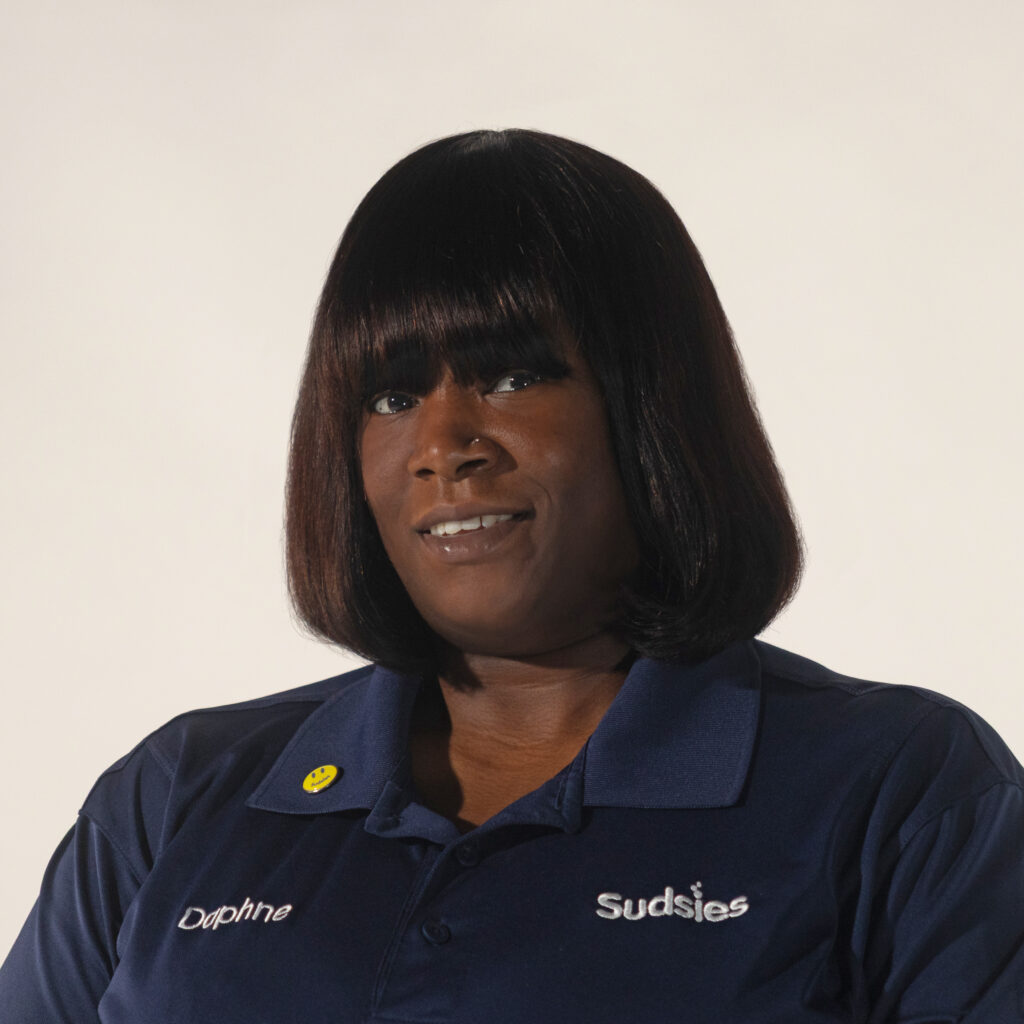 Portrait of Daphne Jean Jacques, Leather & Suede Specialist at Sudsies.