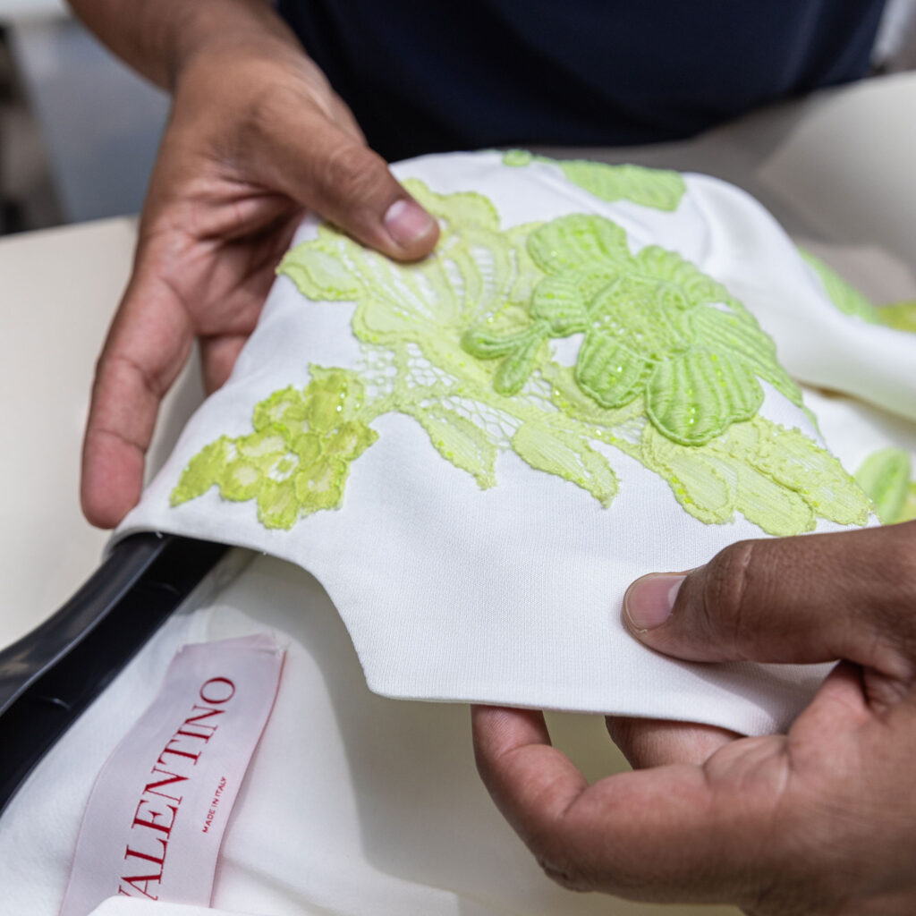 Delicate designer garment with detailed embroidery carefully handled by Sudsies Dry Cleaners