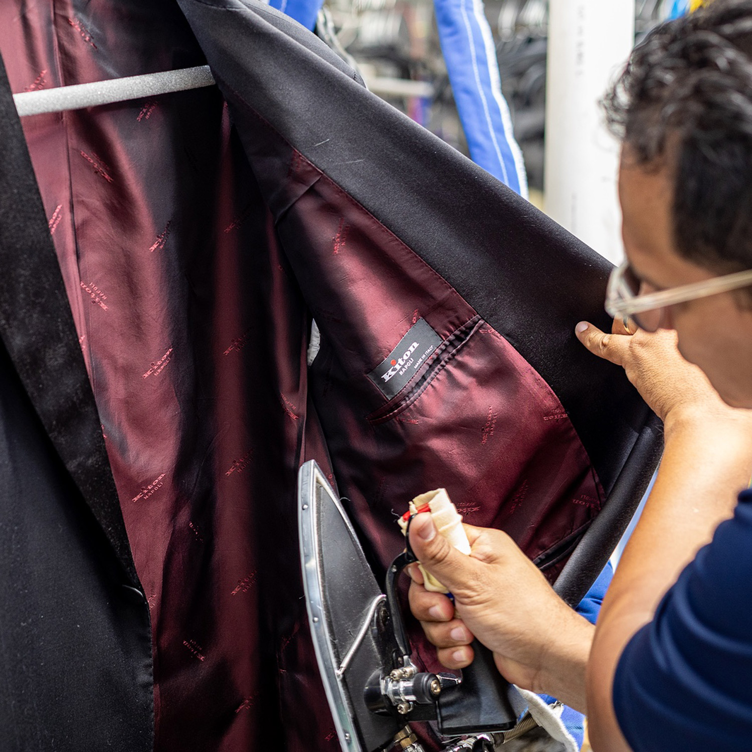 Hand-finishing the interior lining of a Kitony suit jacket at Sudsie