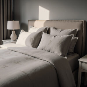 Luxury bed dressed with professionally cleaned linens by Sudsies, styled in a refined Palm Beach bedroom setting