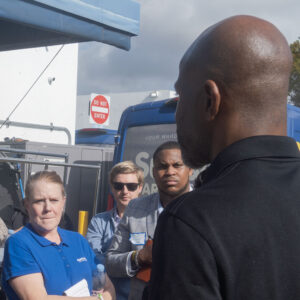 Sudsies team training session with staff gathered near delivery van during operational briefing