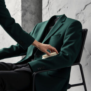 Precision Garment Care by Sudsies | Sudsies | Sudsies Detailing and brushing a tailored jacket to maintain fabric quality and appearance with Sudsies care