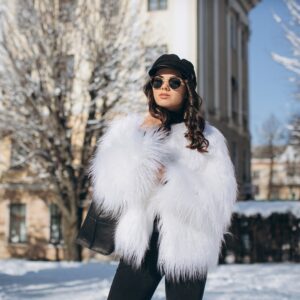 A beautiful stylish fashionable woman in a fur coat hat and g | Sudsies