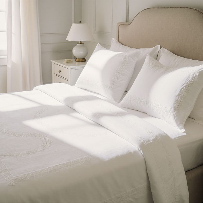 Luxury white bed linens professionally cleaned and pressed by Sudsies Dry Cleaners